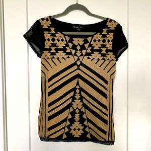 Great condition!  Stand out top with unique asymmetric design. Figure flattering